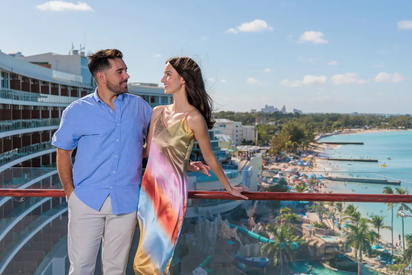 Couple on an oceanfront balcony at Margaritaville Beach Resort - Nassau.