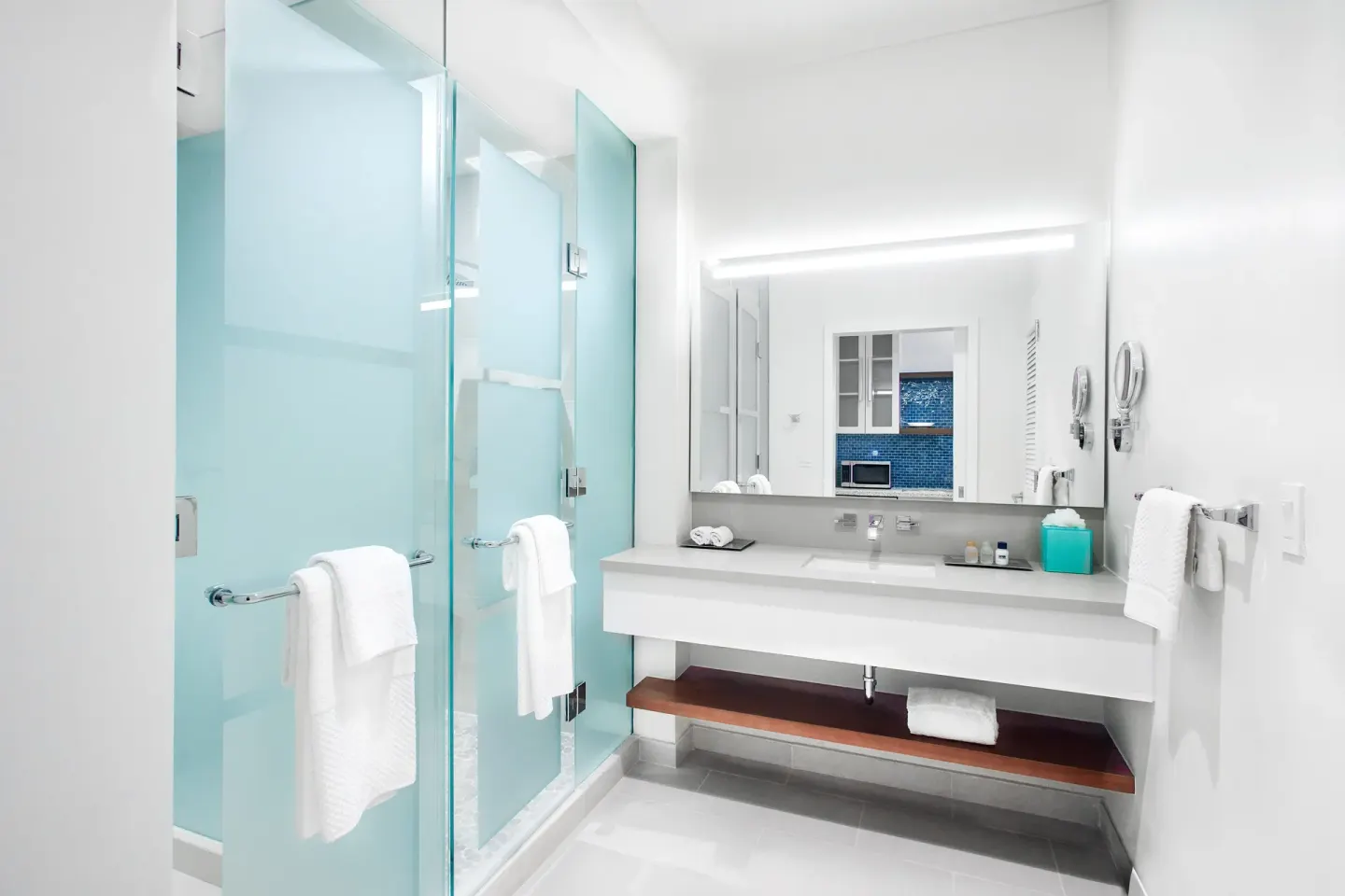 Studio bathroom with glass shower and vanity at Margaritaville Beach Resort - Nassau.