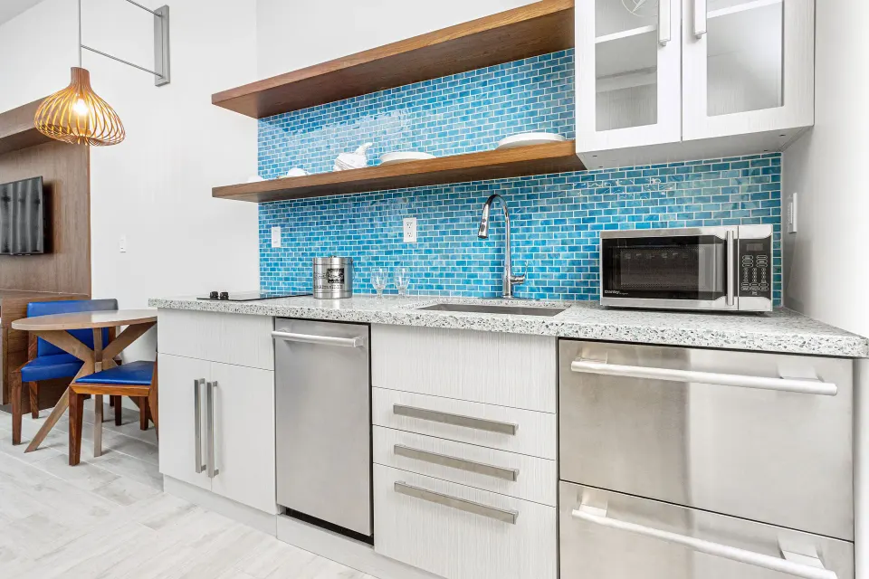 Studio kitchenette with blue tile backsplash at Margaritaville Beach Resort - Nassau.