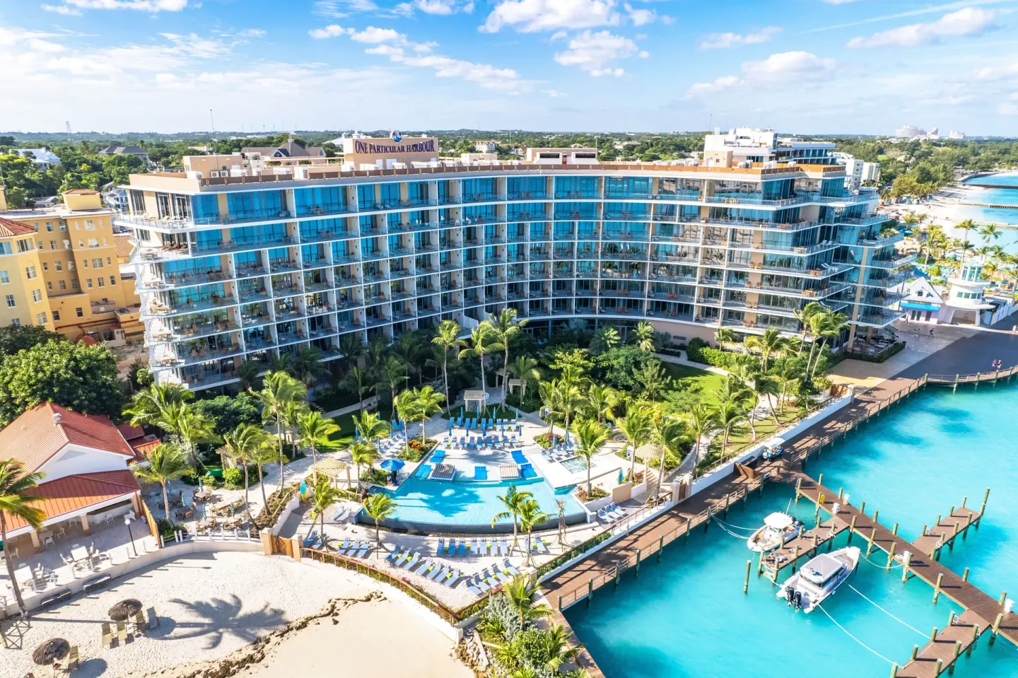 Oceanfront resort building and pool seen from above at Margaritaville Beach Resort - Nassau.