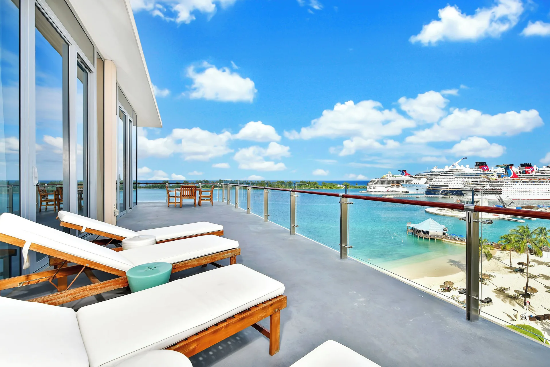 Oceanfront suite balcony with loungers at Margaritaville Beach Resort - Nassau.