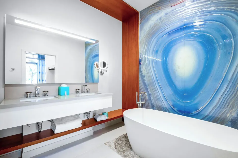 Suite bathroom at Margaritaville Beach Resort - Nassau with soaking tub and double vanity.