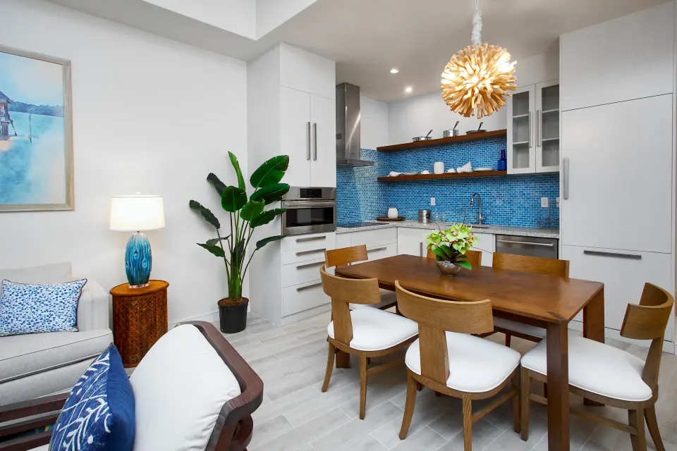 One-bedroom oceanfront suite kitchen and dining area at Margaritaville Beach Resort - Nassau.