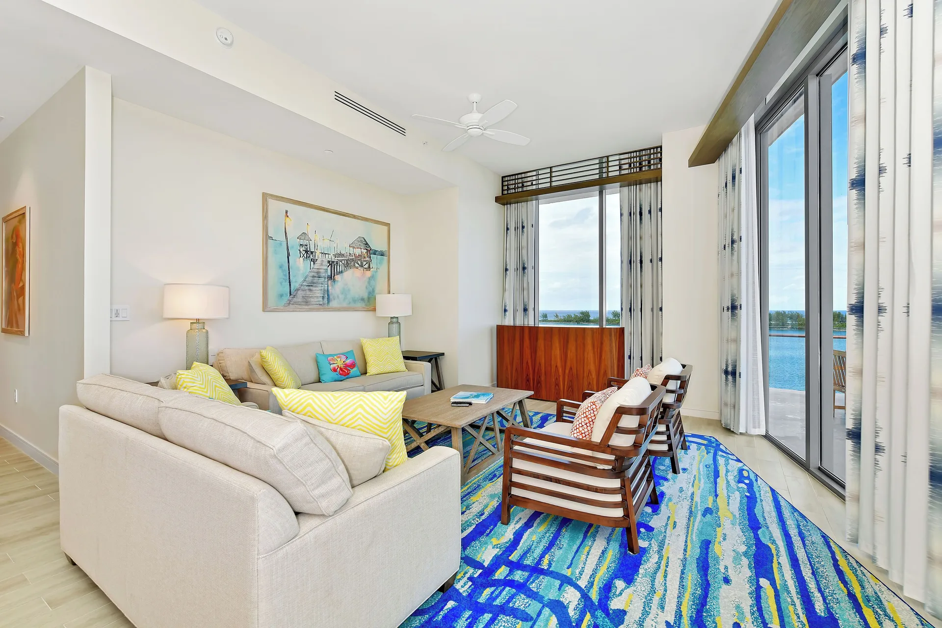 Oceanfront suite living area with balcony doors at Margaritaville Beach Resort - Nassau.