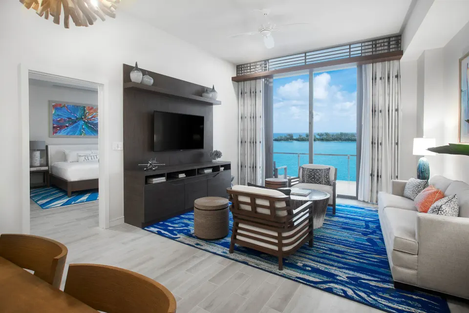 Oceanfront suite living room and bedroom doorway at Margaritaville Beach Resort - Nassau.