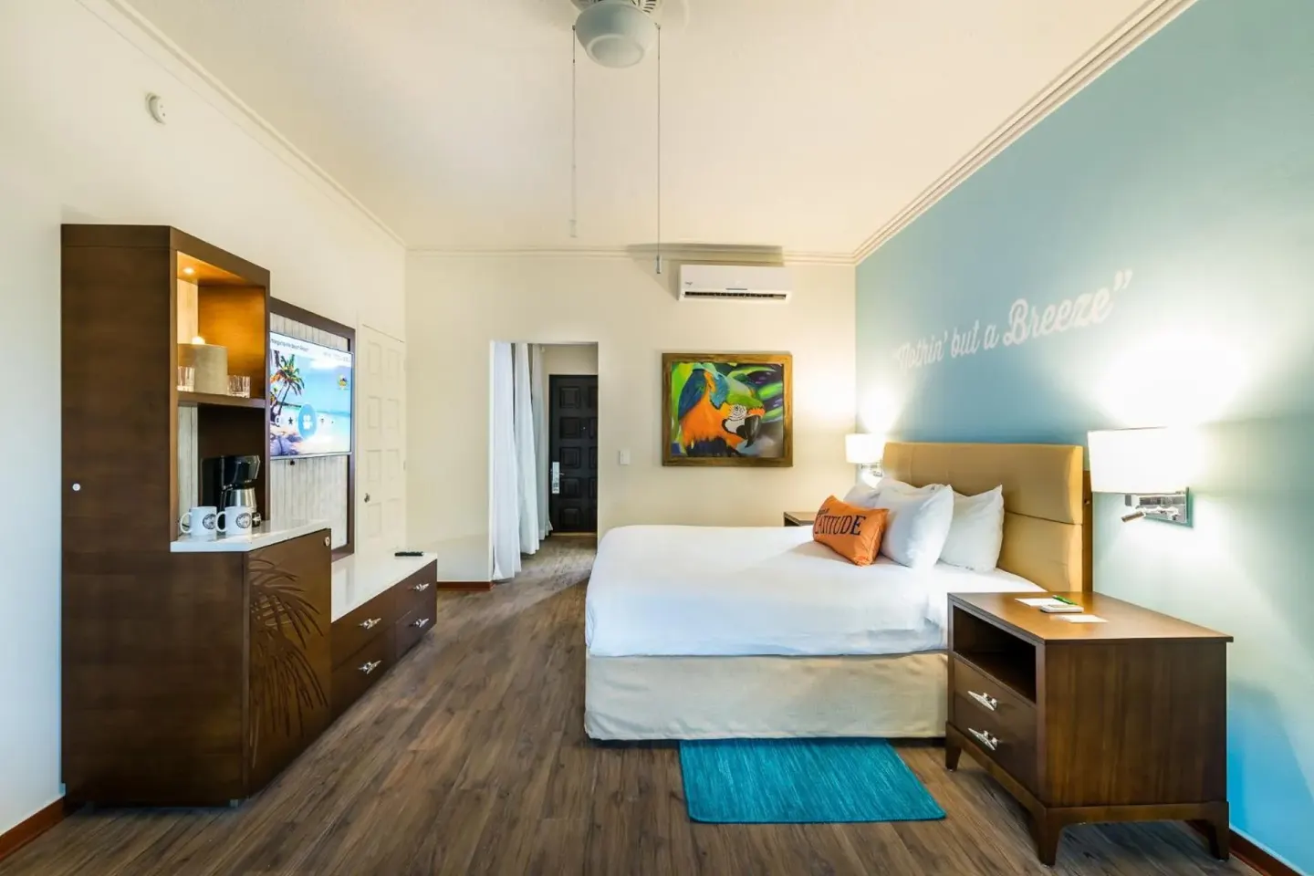 King guest room with turquoise wall at Margaritaville Beach Resort Playa Flamingo.