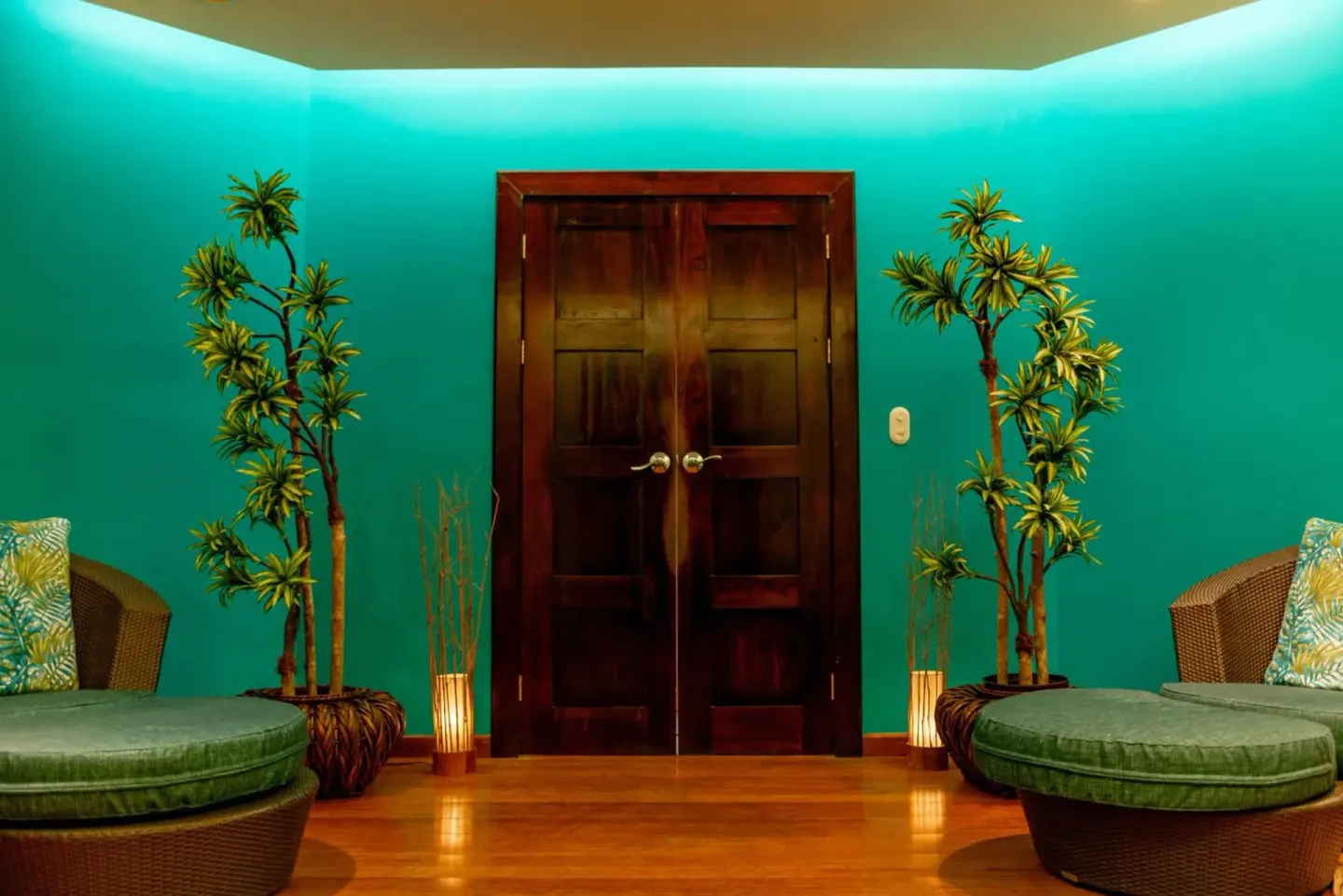 Spa-style lounge entry with teal walls and double doors at Margaritaville Beach Resort Playa Flamingo.