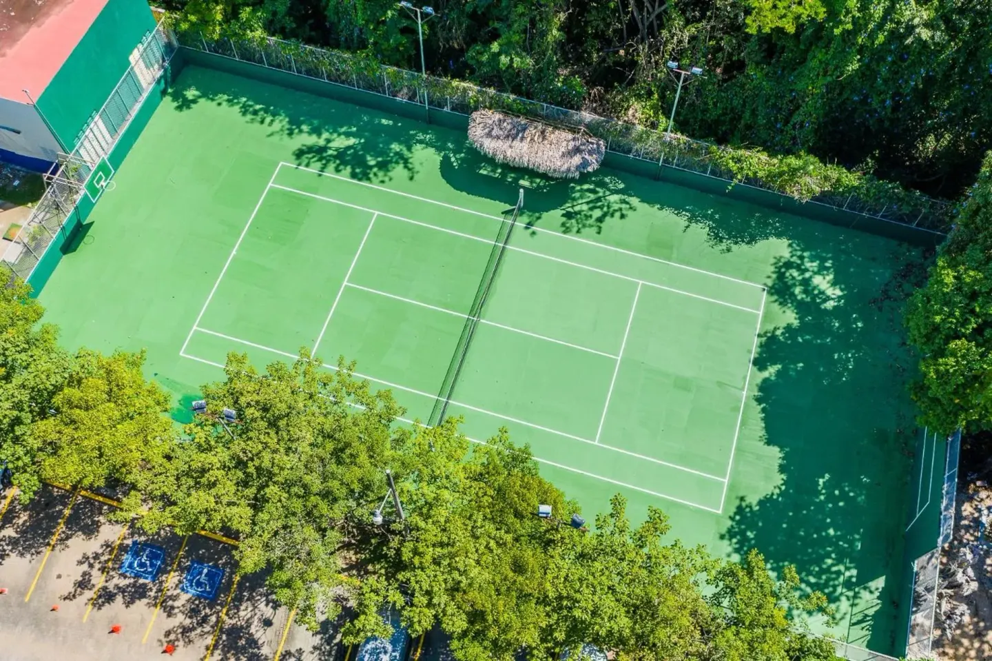 Aerial view of tennis courts at Margaritaville Beach Resort Playa Flamingo.