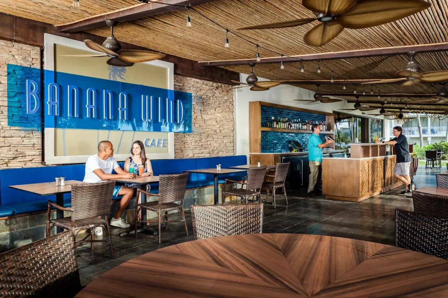 Banana Wind Cafe seating and bar area at Margaritaville Beach Resort Playa Flamingo.