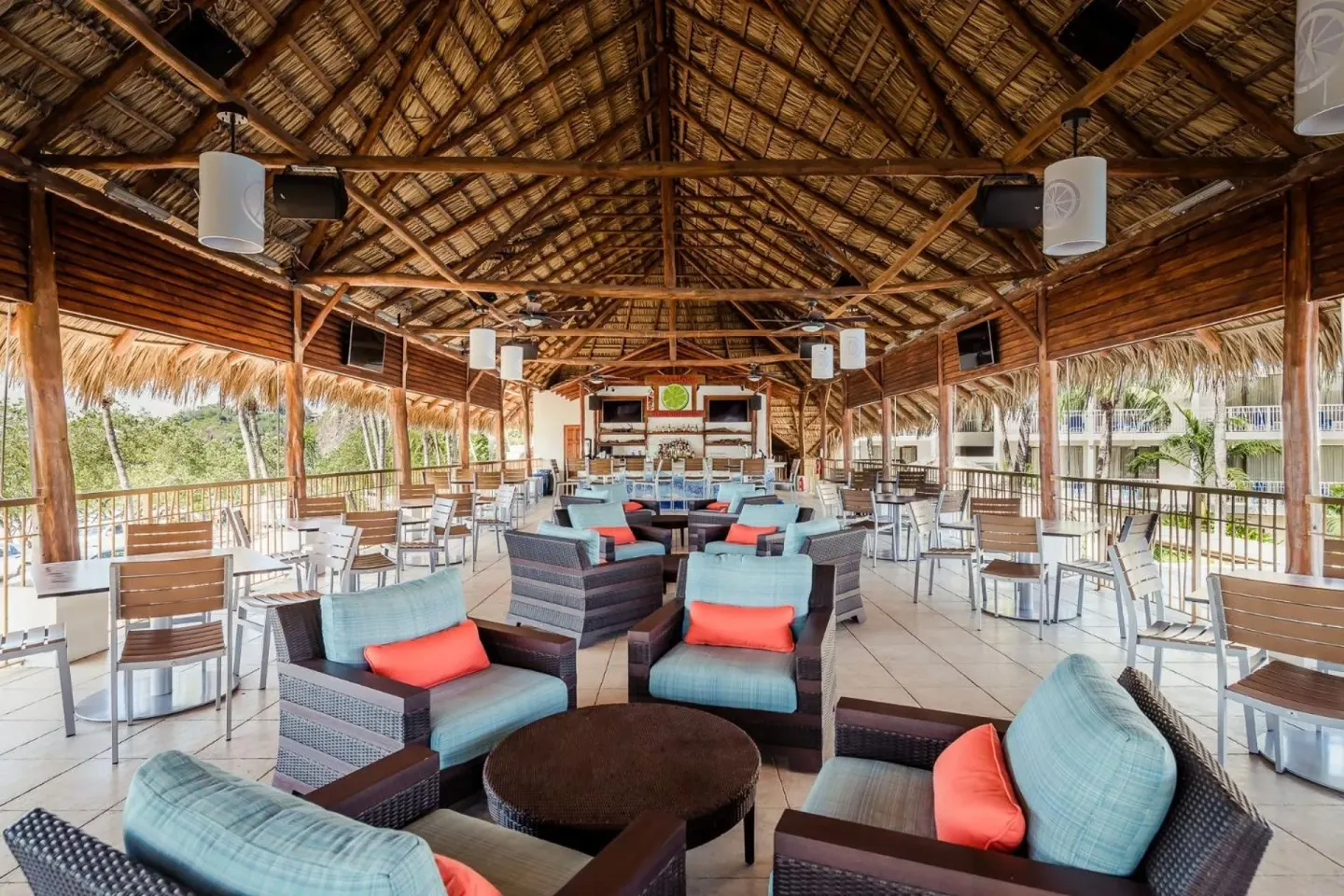 Open-air thatched bar lounge at Margaritaville Beach Resort Playa Flamingo.
