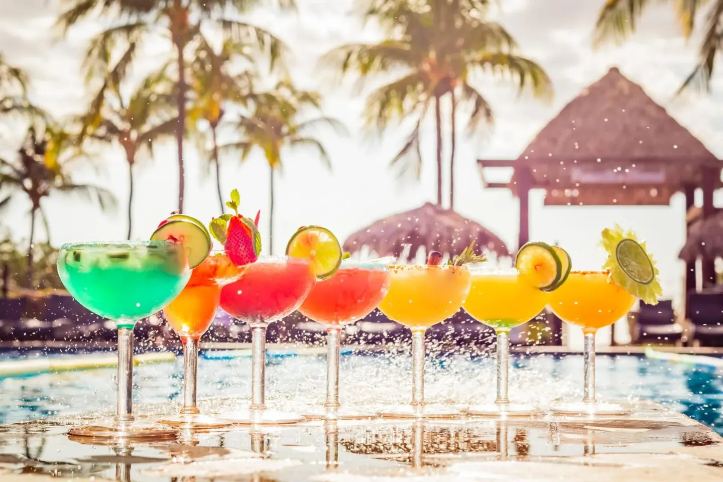 Colorful cocktails lined up by the pool at Margaritaville Beach Resort Playa Flamingo.