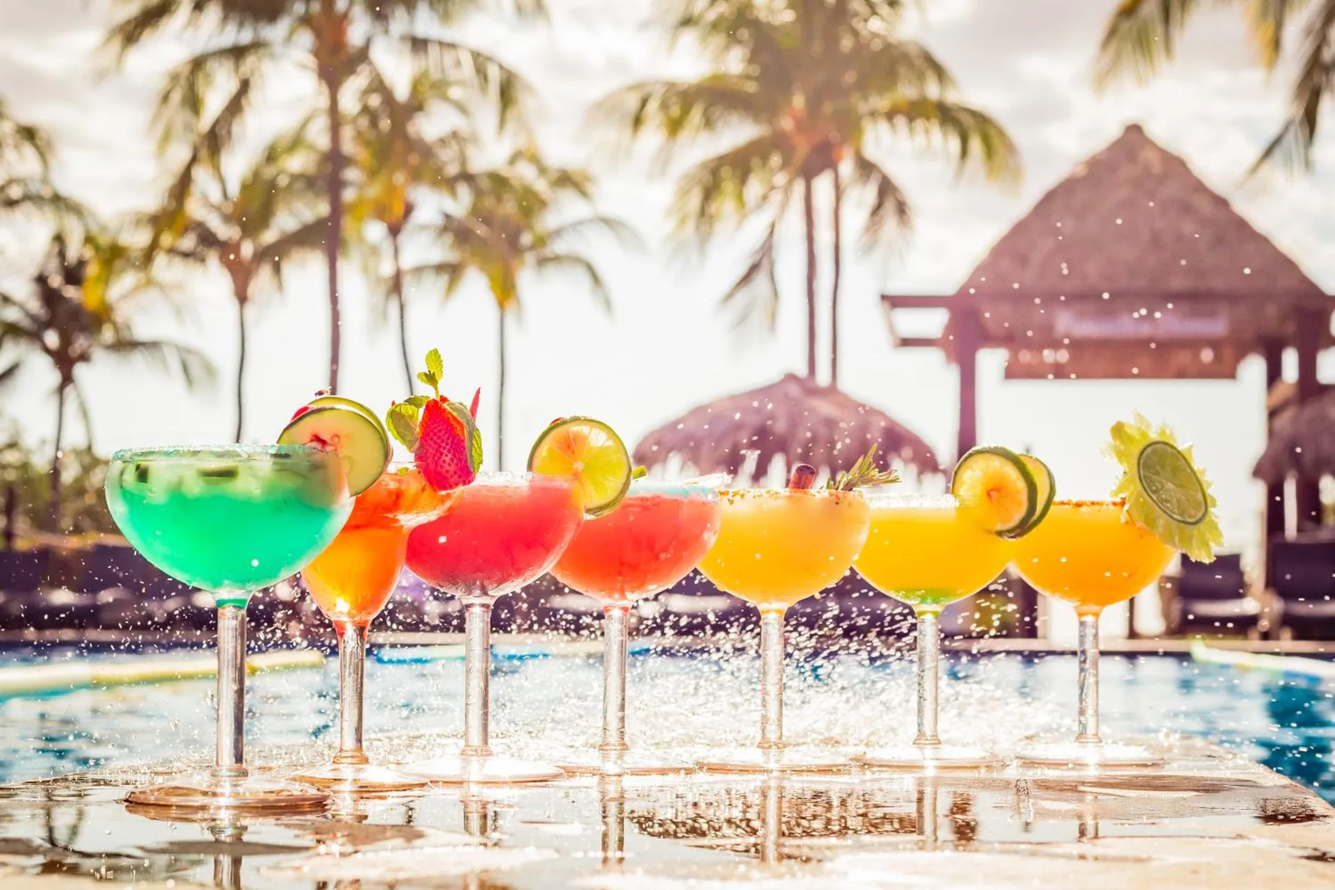 Colorful cocktails lined up by the pool at Margaritaville Beach Resort Playa Flamingo.