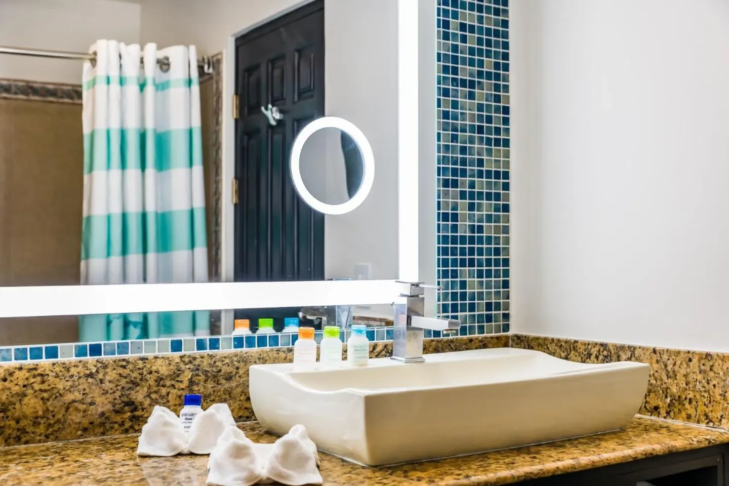 Standard Room bathroom vanity and shower curtain at Margaritaville Beach Resort Playa Flamingo.