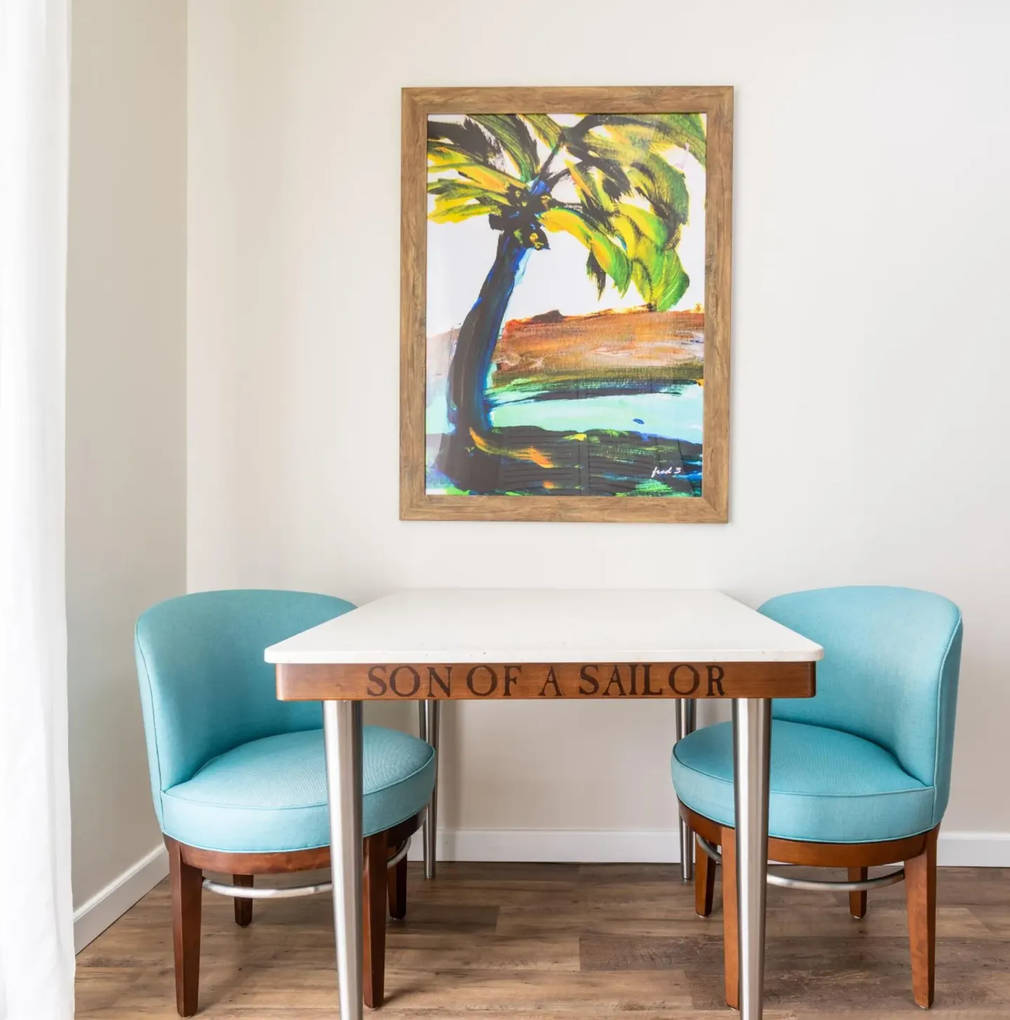 Standard Room dining table and turquoise chairs at Margaritaville Beach Resort Playa Flamingo.