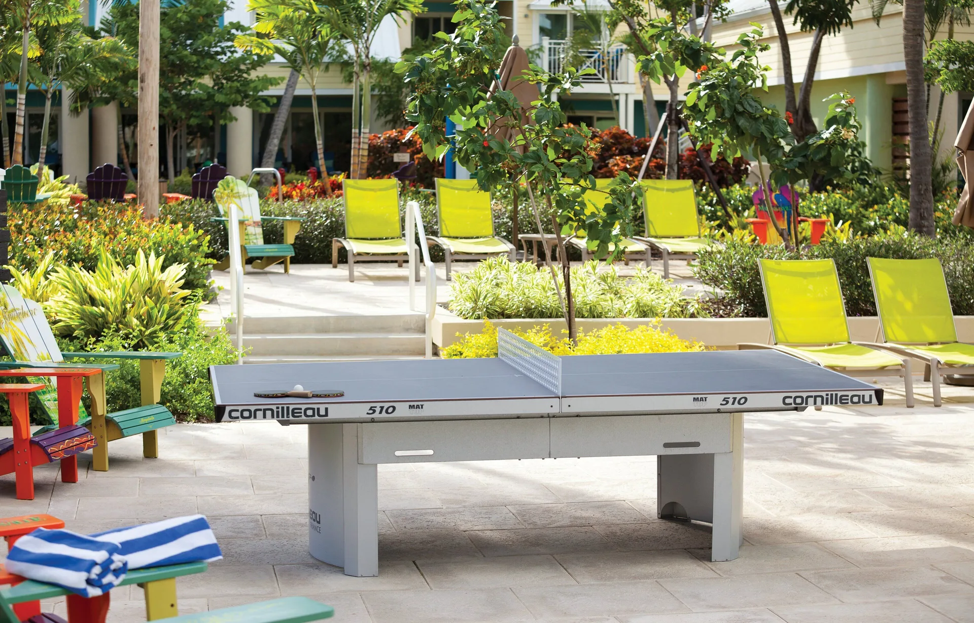 A ping-pong table sits among loungers and gardens at Margaritaville Vacation Club - St. Thomas.
