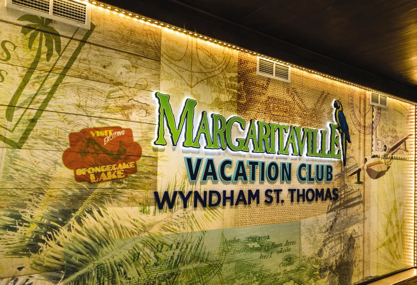 Illuminated resort sign on a tropical mural wall at Margaritaville Vacation Club - St. Thomas.
