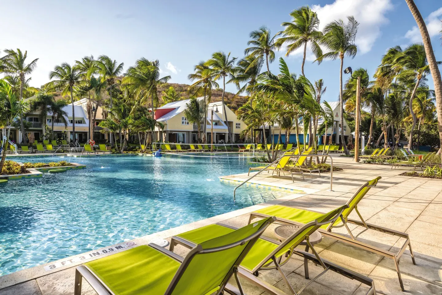 Lagoon-style pool with lime loungers at Margaritaville Vacation Club - St. Thomas.