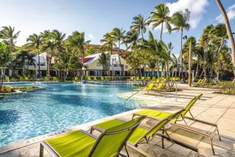 Lagoon-style pool with lime loungers at Margaritaville Vacation Club - St. Thomas.