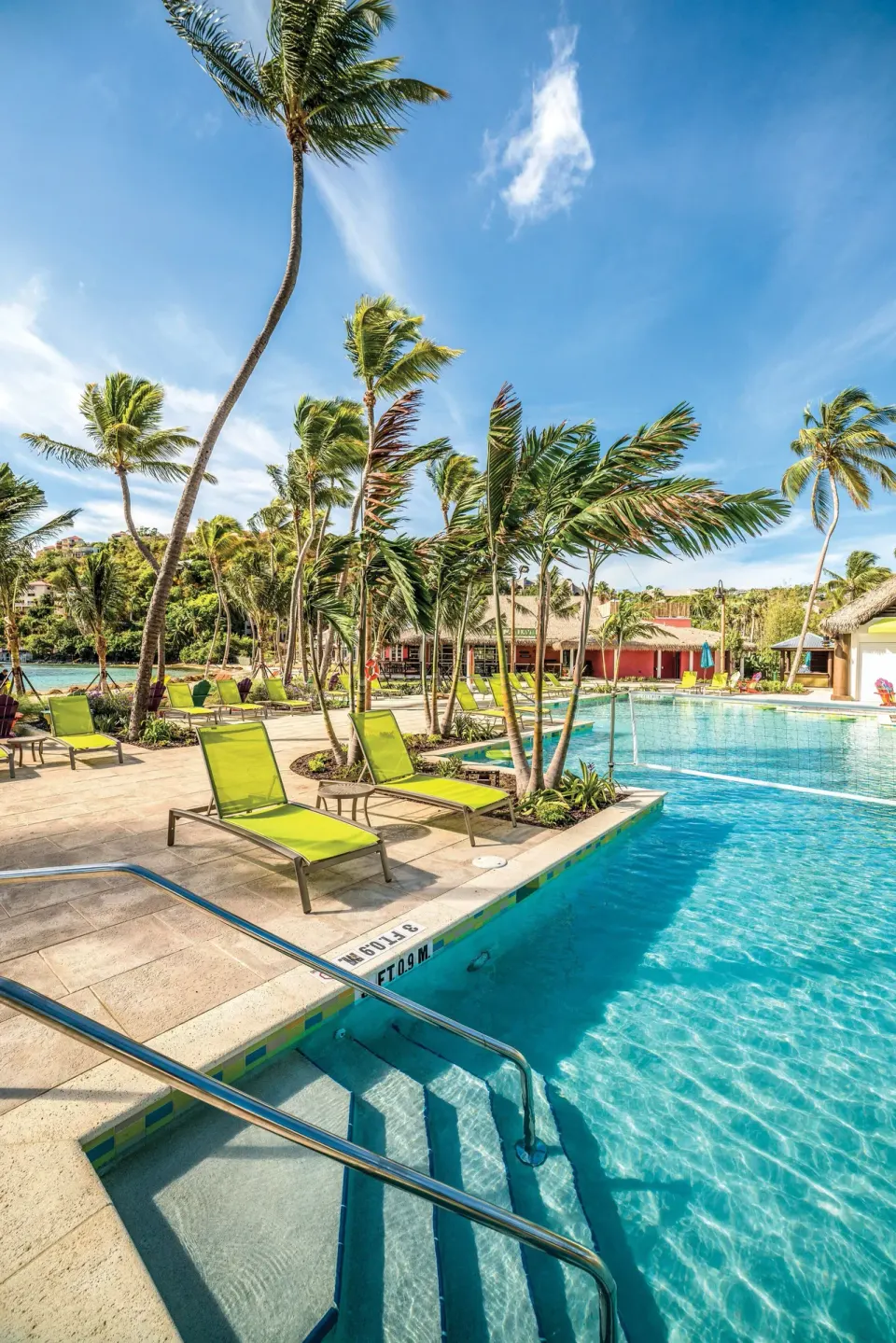 Pool steps, palms, and lounge chairs at Margaritaville Vacation Club - St. Thomas.