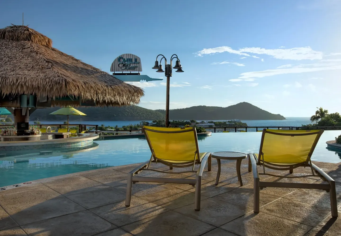 Poolside bar and ocean-view loungers at Margaritaville Vacation Club - St. Thomas.