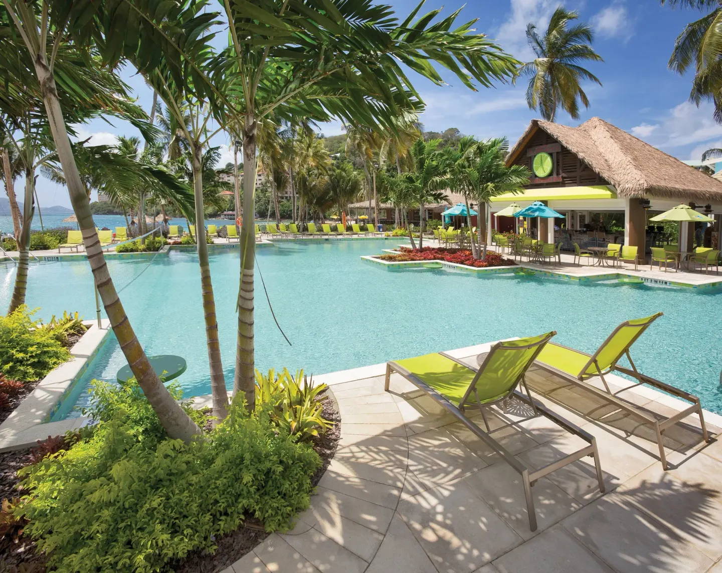 Resort pool with palms and loungers at Margaritaville Vacation Club - St. Thomas.