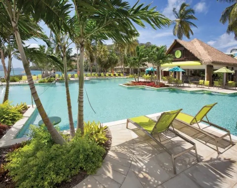 Resort pool with palms and loungers at Margaritaville Vacation Club - St. Thomas.