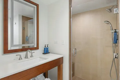Standard 1 Bedroom condo bathroom vanity and shower at Margaritaville Vacation Club - St. Thomas.
