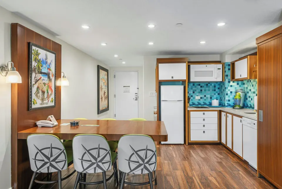 Standard 1 Bedroom condo dining table and kitchenette at Margaritaville Vacation Club - St. Thomas.