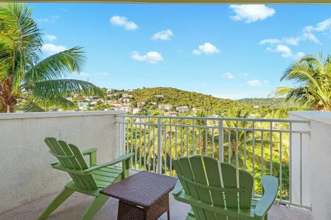 Private balcony with green chairs at Margaritaville Vacation Club - St. Thomas.