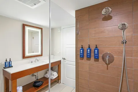 Bathroom vanity and tiled shower at Margaritaville Vacation Club - St. Thomas.