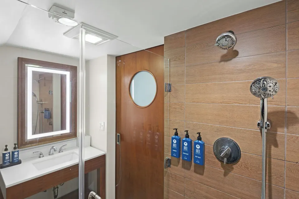 Studio suite bathroom shower and vanity at Margaritaville Vacation Club - St. Thomas.