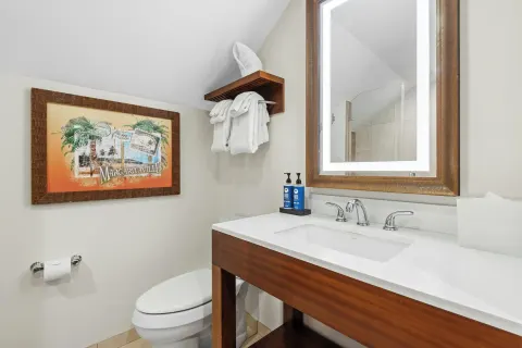 Studio suite bathroom vanity and toilet at Margaritaville Vacation Club - St. Thomas.