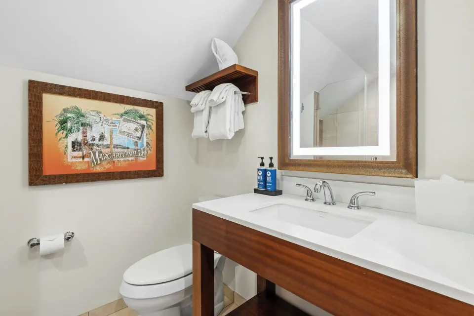 Studio suite bathroom vanity and toilet at Margaritaville Vacation Club - St. Thomas.