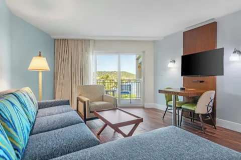 Studio suite living area with balcony doors at Margaritaville Vacation Club - St. Thomas.