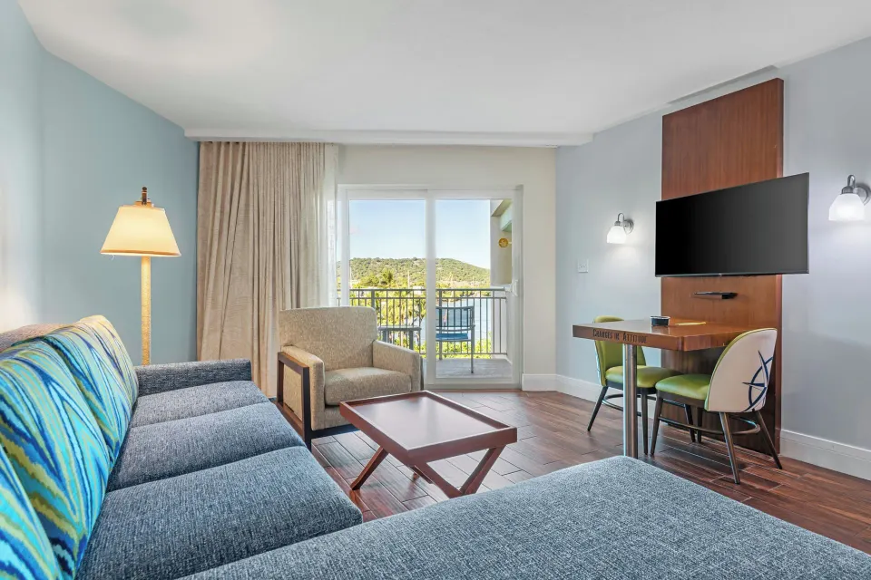 Studio suite living area with balcony doors at Margaritaville Vacation Club - St. Thomas.