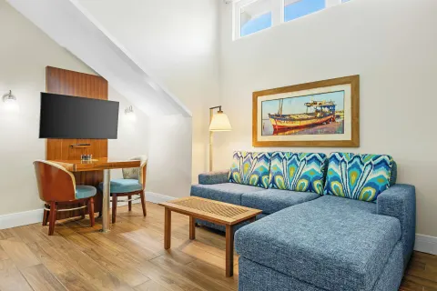 Studio Suite sitting area with sectional sofa at Margaritaville Vacation Club - St. Thomas.