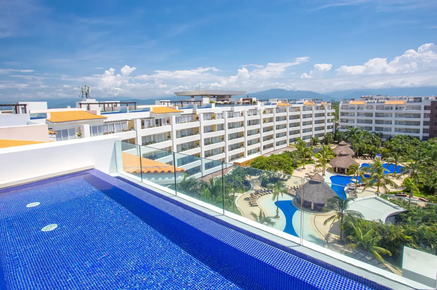 Rooftop infinity pool overlooking the resort grounds at Marival Distinct World Spa.