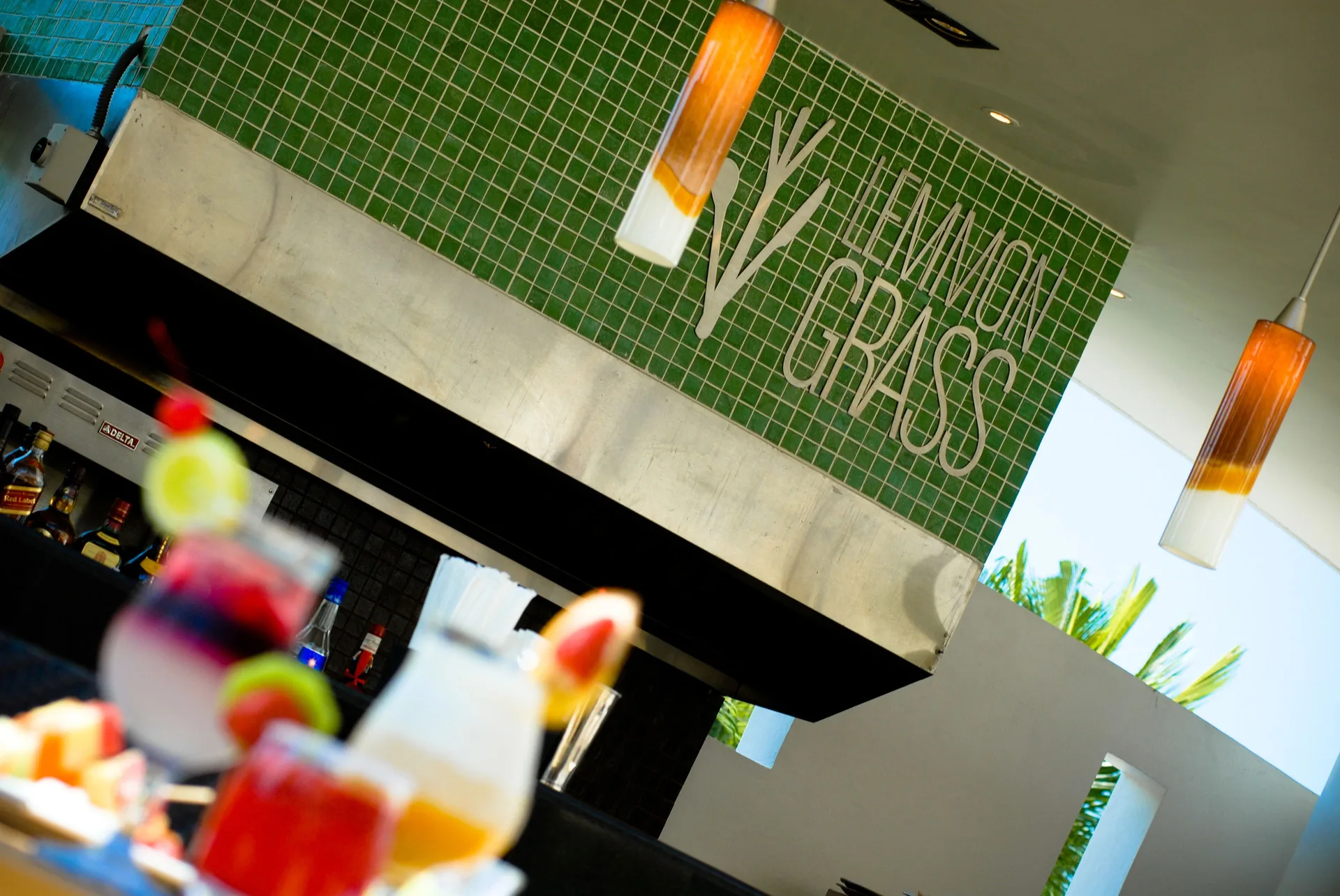 Lemmon Grass bar sign with colorful drinks at Marival Distinct World Spa.