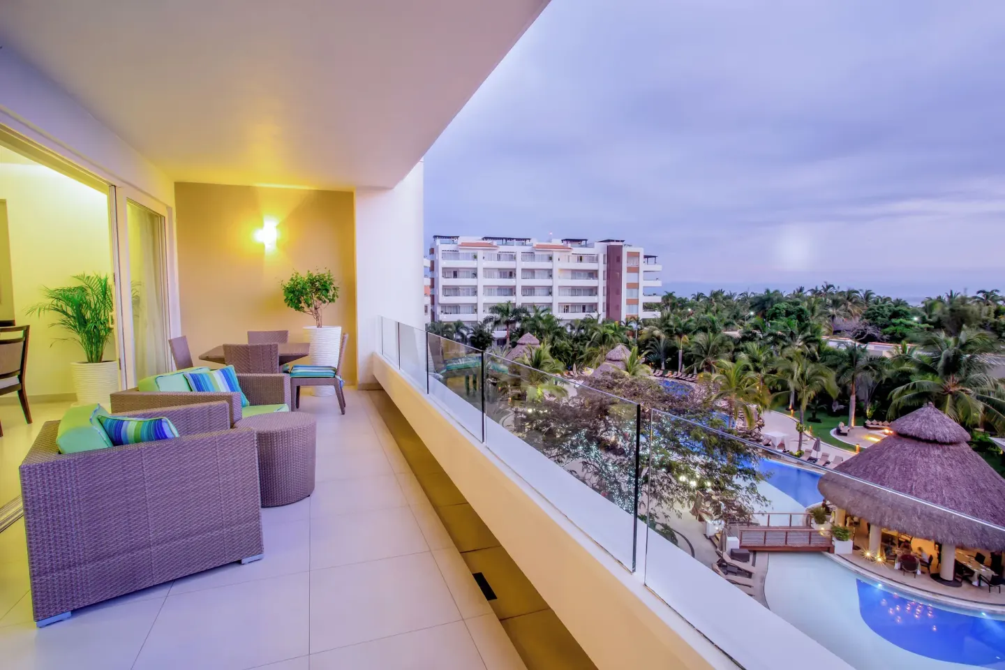 One-Bedroom Ocean View Suite balcony with seating and ocean view at Marival Distinct World Spa.