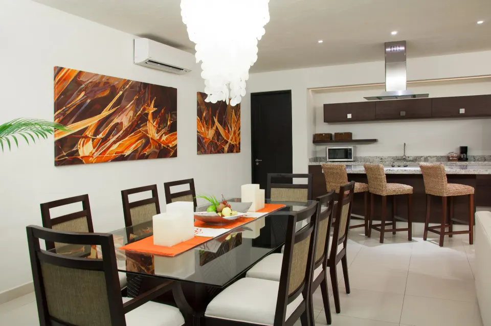 One-Bedroom Penthouse dining table and kitchen at Marival Distinct World Spa.
