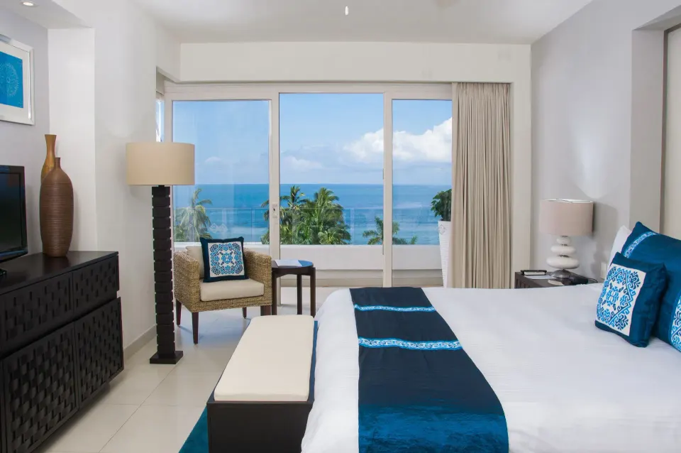 One-Bedroom Penthouse king bed with ocean view at Marival Distinct World Spa.
