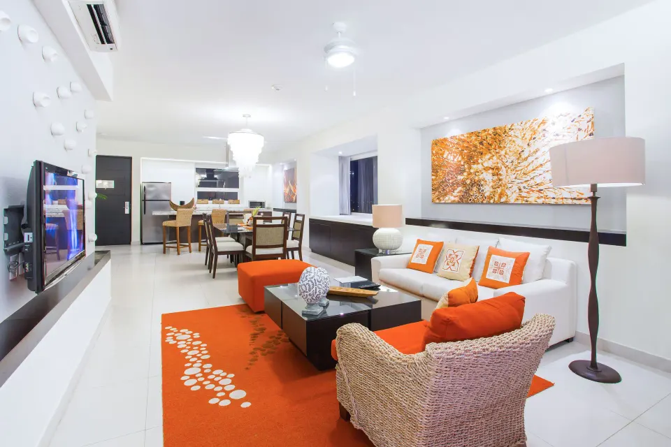 One-Bedroom Penthouse living room with sofa and kitchen at Marival Distinct World Spa.