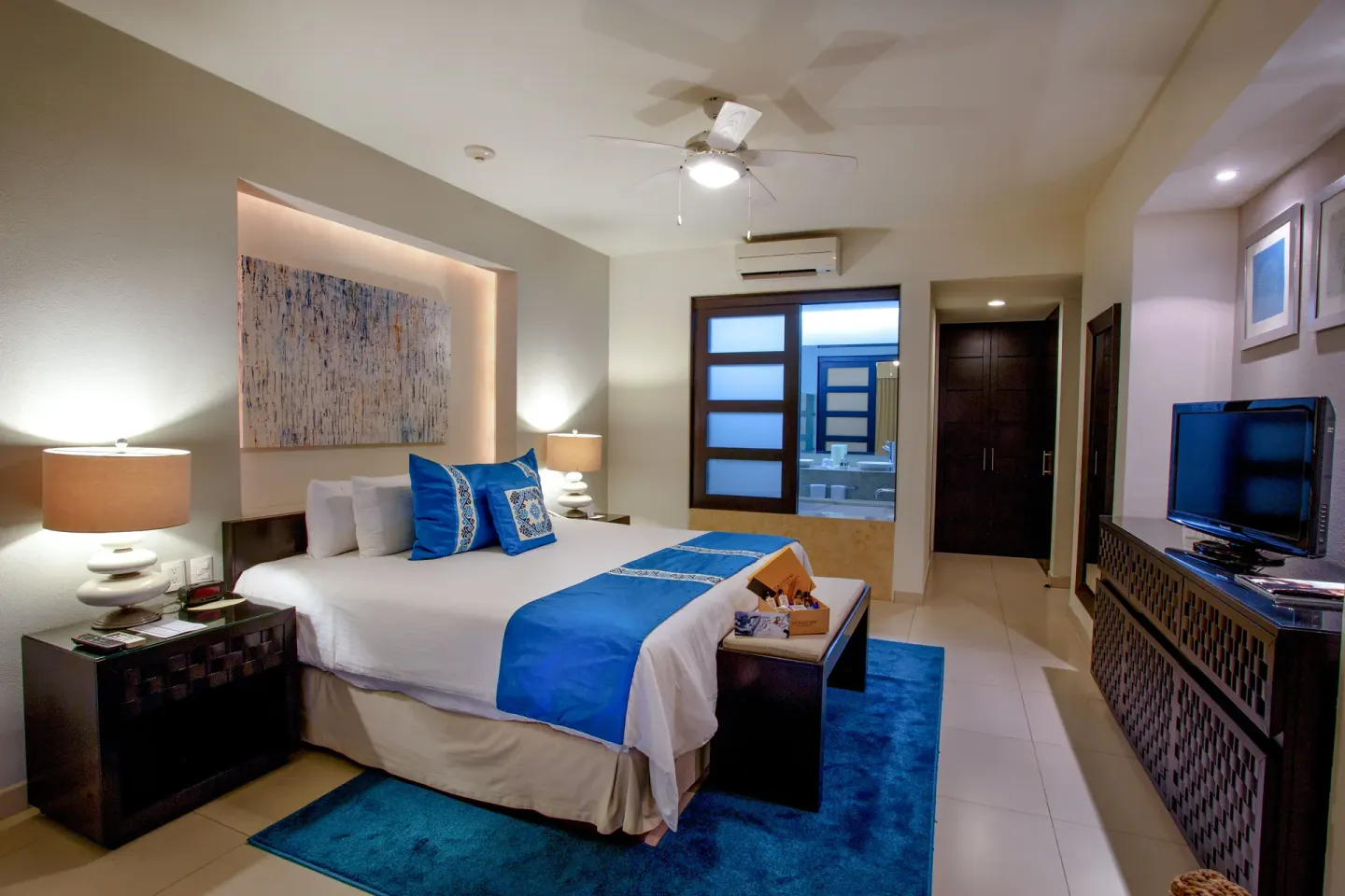 Bedroom in a Three-Bedroom Suite 2 with a king bed at Marival Distinct World Spa.