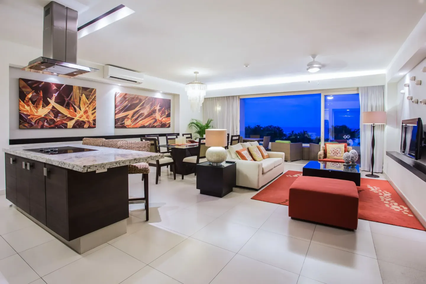 Living and kitchen area in Three-Bedroom Suite 2 at Marival Distinct World Spa.