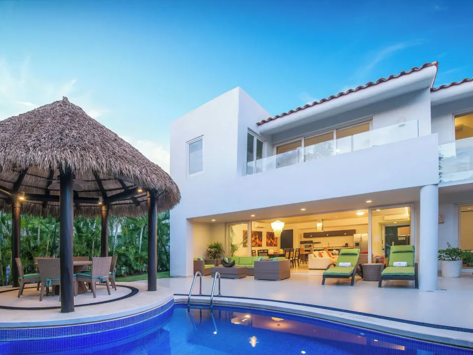 Three-Bedroom Villa exterior with pool and palapa at Marival Distinct World Spa.