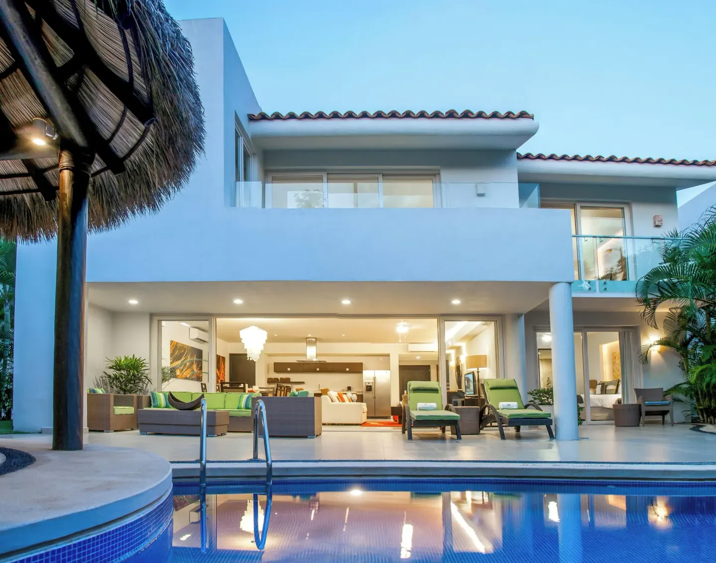 Three-Bedroom Villa pool view with balconies and terrace seating at Marival Distinct World Spa.