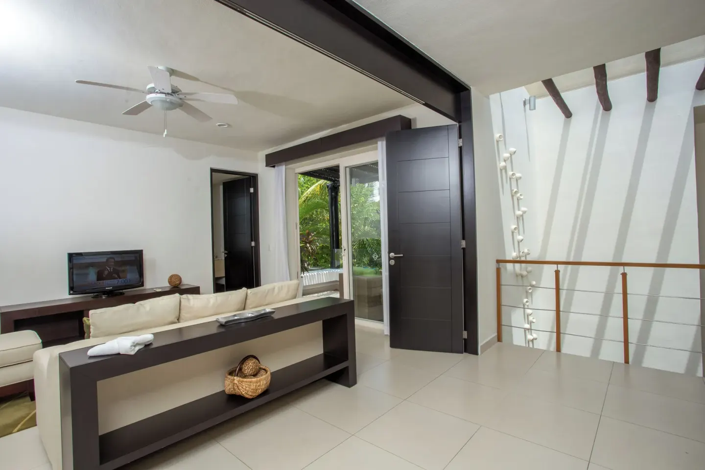 Three-Bedroom Villa upstairs lounge and stair landing at Marival Distinct World Spa.