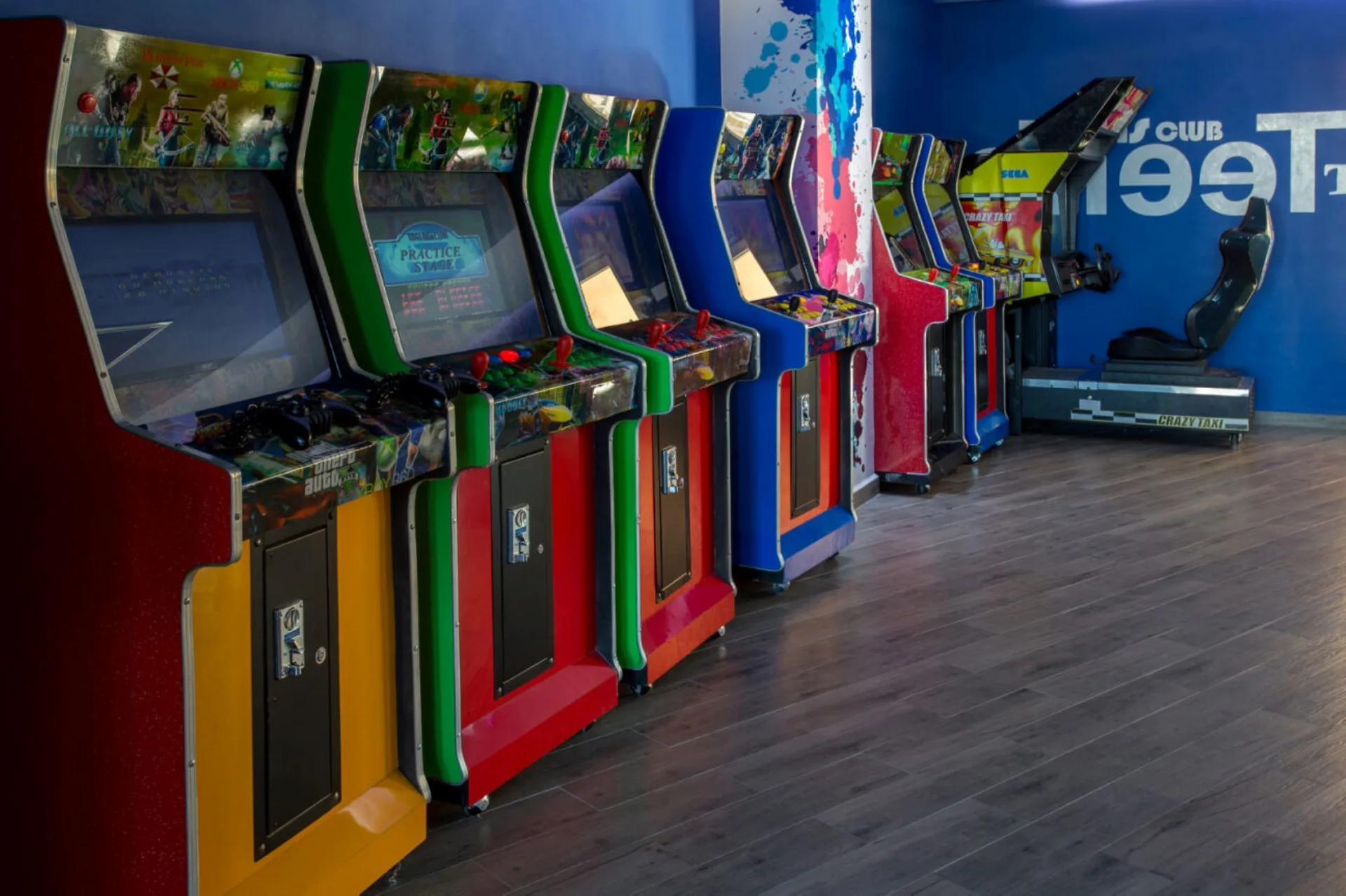 Rows of colorful arcade machines in the teens club at Marival Emotions Resort.