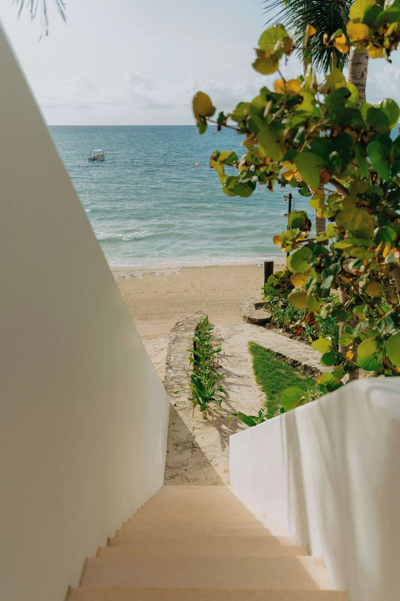Beach access stairway at Maroma, Riviera Maya leading down toward the sand and sea.