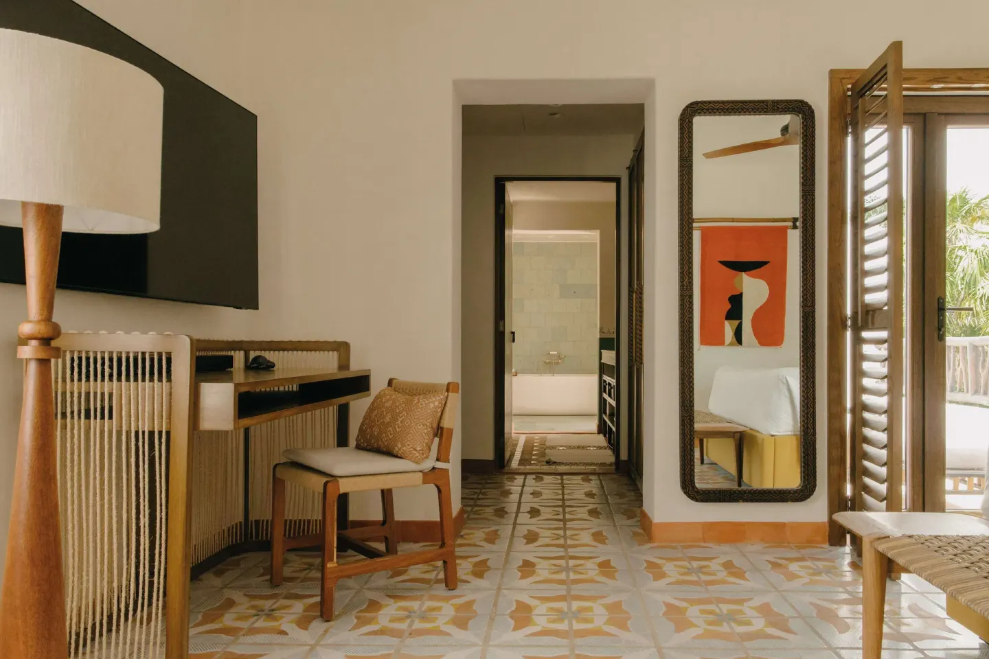 Guest room desk, mirror, balcony doors and bathroom doorway at Maroma, Riviera Maya.